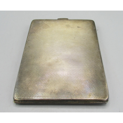 156 - ER.II Hallmarked Sterling silver cigarette case with engine turned decoration, the gilded interior w... 