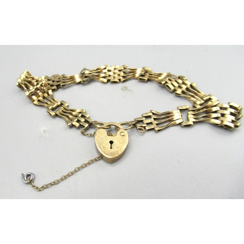 157 - 9ct yellow gold four bar gate bracelet, and a 9ct gold St. Christopher pendant on 9ct gold chain , a... 