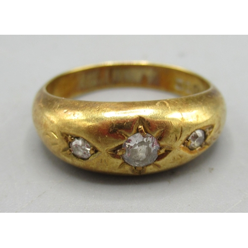 171 - 18ct yellow gold gypsy ring set with three diamonds, stamped 18, size O, 3.76g