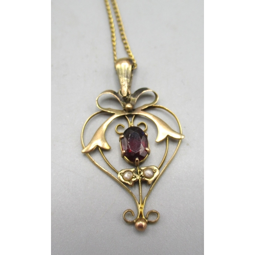 19 - Edwardian yellow metal drop pendant set with seed pearls and red stone, on yellow metal chain, a 9ct... 