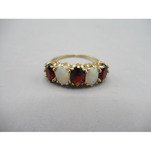 241 - 9ct yellow gold five stone garnet and opal ring, size M1/2, a 9ct gold ring set with green and clear... 