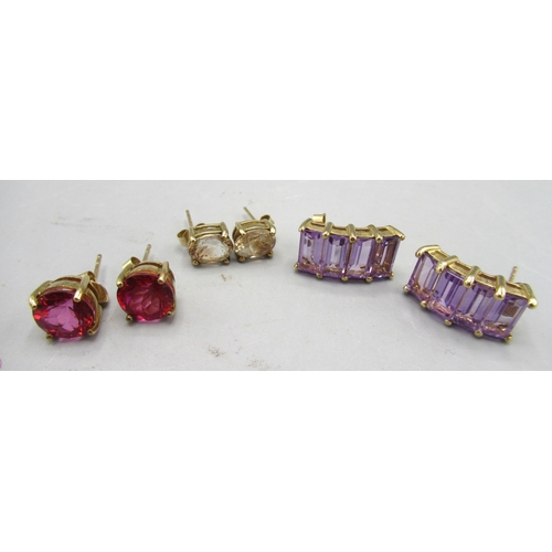 255 - Three pairs of 9ct yellow gold earrings, set with amethyst, champagne topaz and red topaz, all stamp... 