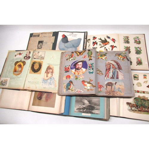 259 - Collection of early 20th century scrapbooks containing assorted prints, greetings cards, comic strip... 