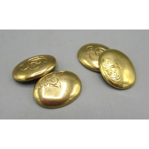 29 - 9ct gold oval shaped cufflinks with engraved initials ED and foliage detail, stamped 375, 3.09g