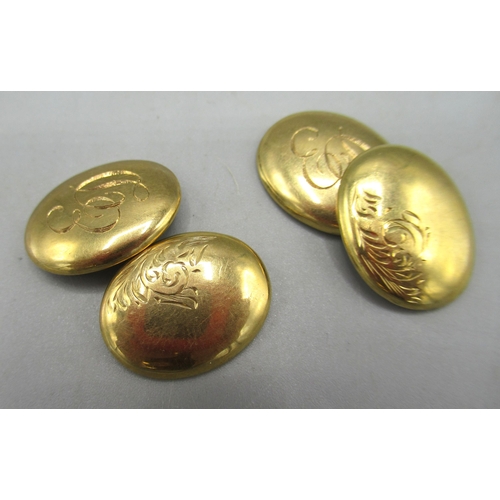 29 - 9ct gold oval shaped cufflinks with engraved initials ED and foliage detail, stamped 375, 3.09g