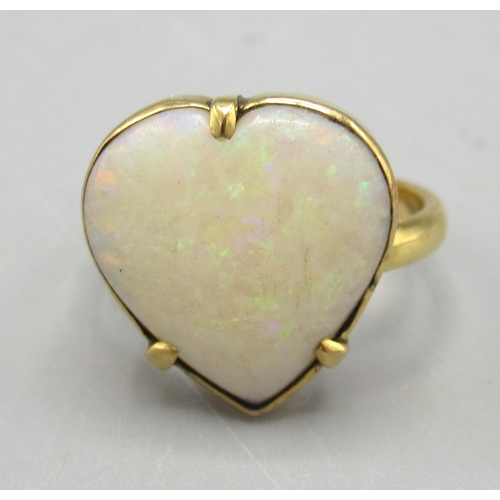 7 - Antique yellow metal ring with claw set heart shaped cabochon cut opal, unmarked, size J, 3.35g