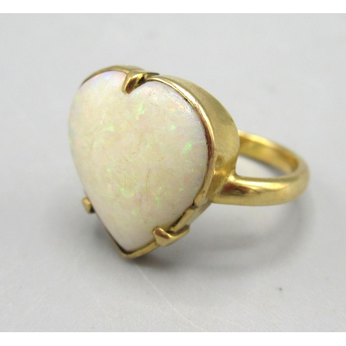 7 - Antique yellow metal ring with claw set heart shaped cabochon cut opal, unmarked, size J, 3.35g