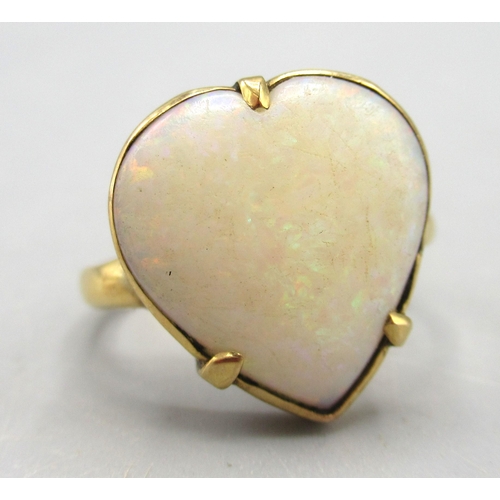 7 - Antique yellow metal ring with claw set heart shaped cabochon cut opal, unmarked, size J, 3.35g