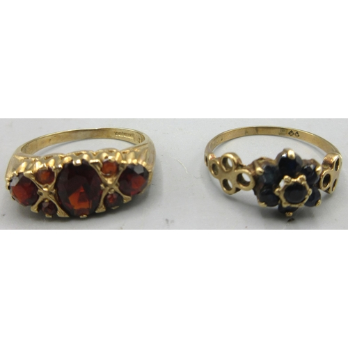 150 - 9ct yellow gold ring set with seven garnets, size M, stamped 375, and a yellow metal floral cluster ... 