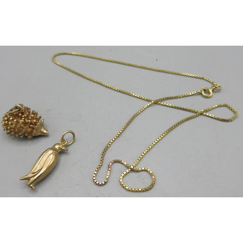 152 - 9ct yellow gold penguin charm, a 9ct yellow gold chain necklace, both stamped 375, 2.74g, and a yell... 