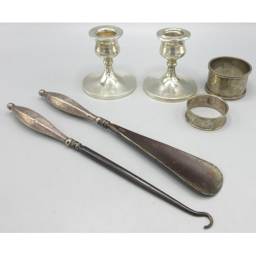 182 - Pair of C20th silver candlesticks with weighted bases, two Edwardian silver napkin rings with engrav... 