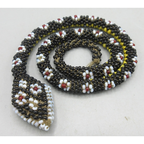 133 - Circa WWI Turkish prisoner of war beaded snake, with black yellow and floral-like beading, L34cm