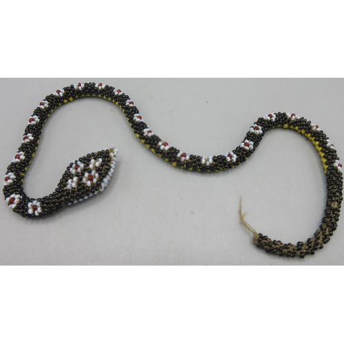 133 - Circa WWI Turkish prisoner of war beaded snake, with black yellow and floral-like beading, L34cm