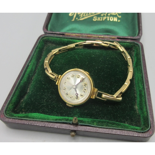 39 - Swiss 18ct gold ladies wristwatch with engine turned silver dial on 9ct rolled gold expanding bracel... 