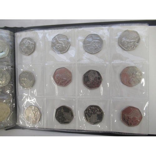 780 - Black coin folder cont. assortment of commemorative 50ps (111) £1s (2) and £2s (6) to inc. Olympics ... 