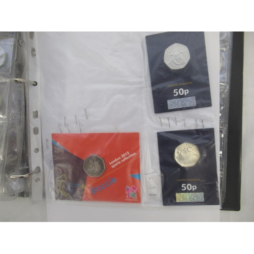 781 - Red coin folder and slip-case cont. collection of commemorative 50ps (90), 10ps (54) & £2s (33) to i... 