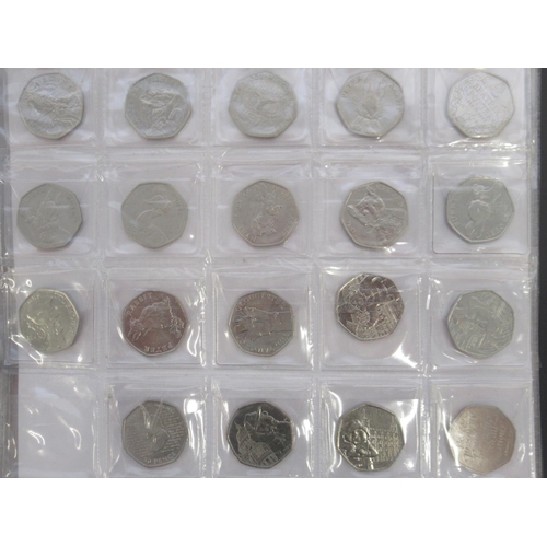 781 - Red coin folder and slip-case cont. collection of commemorative 50ps (90), 10ps (54) & £2s (33) to i... 