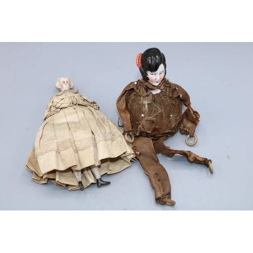 222 - Early 20th century pin cushion doll; and a bisque head and shoulder doll's house doll, H15cm (2)