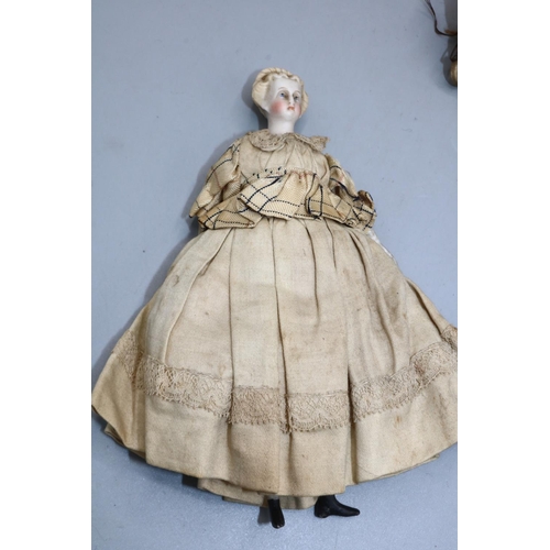 222 - Early 20th century pin cushion doll; and a bisque head and shoulder doll's house doll, H15cm (2)