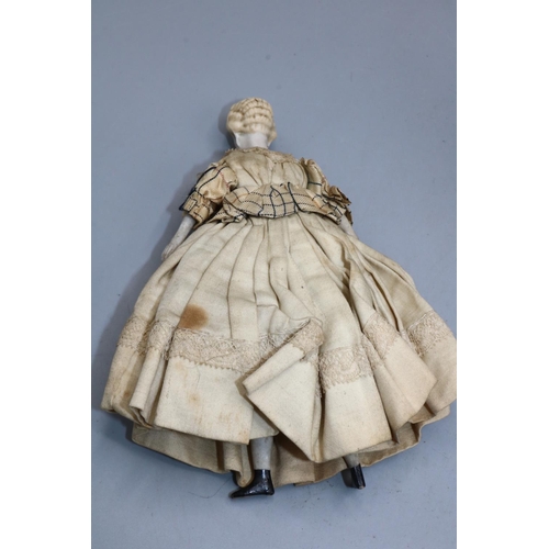 222 - Early 20th century pin cushion doll; and a bisque head and shoulder doll's house doll, H15cm (2)