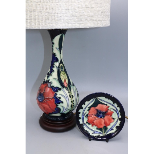 701 - Rachel Bishop for Moorcroft, Poppy pattern baluster form table lamp with shade and a pin dish in the... 