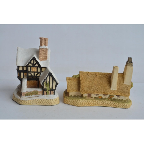 364 - Four boxed cottage models from David Winter to include Mr Fezziwig's Emporium (damage to chimney), O... 