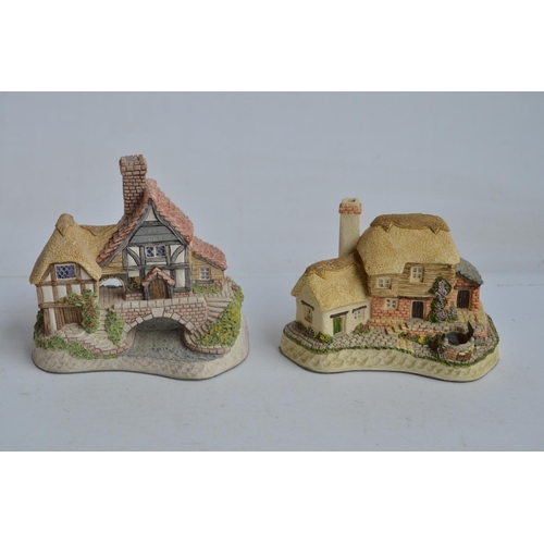 364 - Four boxed cottage models from David Winter to include Mr Fezziwig's Emporium (damage to chimney), O... 