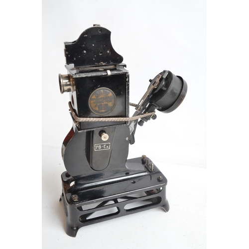 379 - Two vintage 9.5mm film projectors to include a Pathescope Princess and a cased Pathe Baby with a col... 