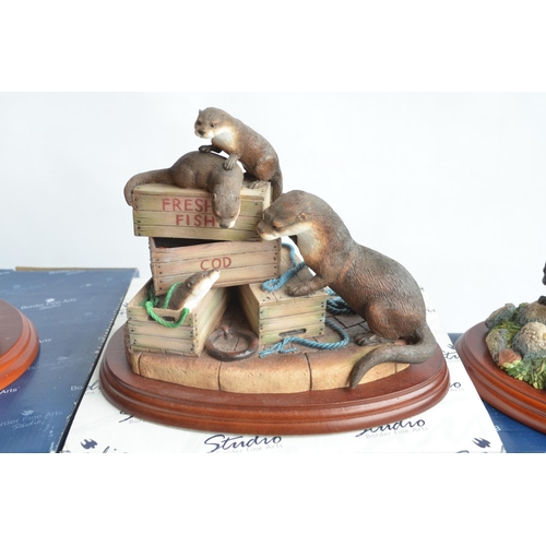 734 - Four boxed Otter sculptures from Border Fine Arts to include A1673 'Otter' (damaged/repaired, see ph... 