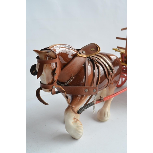 569 - Large ceramic shire horse and wooden cart model, no makers marks (overall length approx 89cm) and 2 ... 