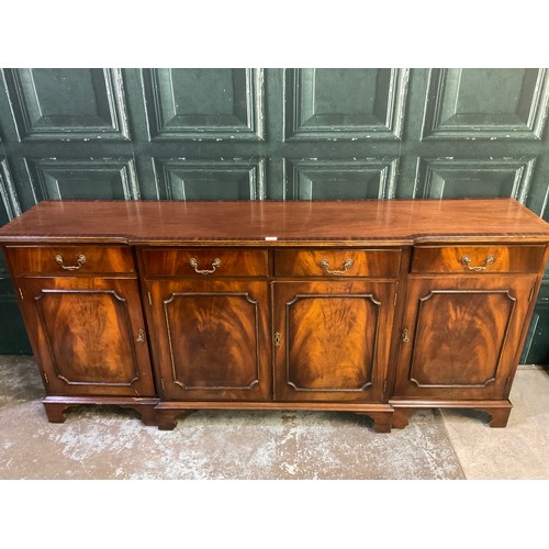 670 - Reprodux mahogany break front sideboard on bracket feet, W194cm D44cm H86cm