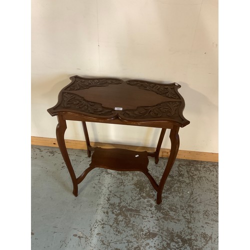 203 - Edwardian mahogany two tier occasional table with carved shaped top, W71cm H78cm