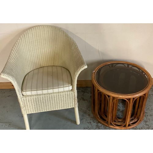 683 - Cream finish Lloyd Loom arm chair, with brass makers label and n nest of three bamboo circular table... 