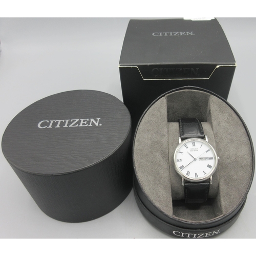 506 - Citizen Eco-Drive stainless steel quartz wristwatch with day date, signed white Roman dial, centre s... 