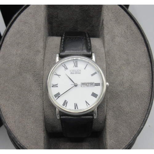 506 - Citizen Eco-Drive stainless steel quartz wristwatch with day date, signed white Roman dial, centre s... 