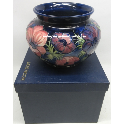 698 - Moorcroft Pottery, Anemone pattern jardiniere, red and purple flowers on dark blue ground, H21cm, wi... 