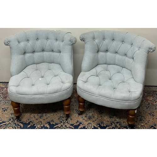 437 - Pair of Victorian style scroll back salon chairs, deep buttoned blue upholstered on turned supports ... 