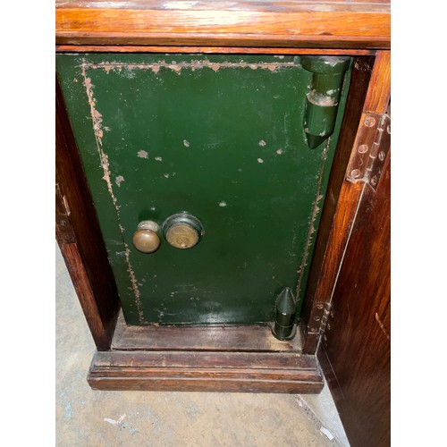 435 - Small green painted safe with Yale key lock, in oak cabinet, W35cm D36cm H50cm