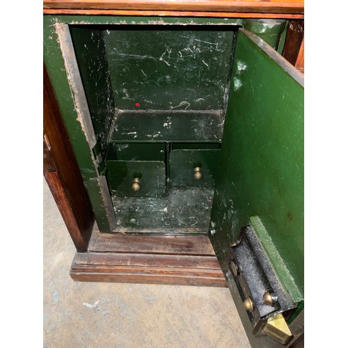 435 - Small green painted safe with Yale key lock, in oak cabinet, W35cm D36cm H50cm