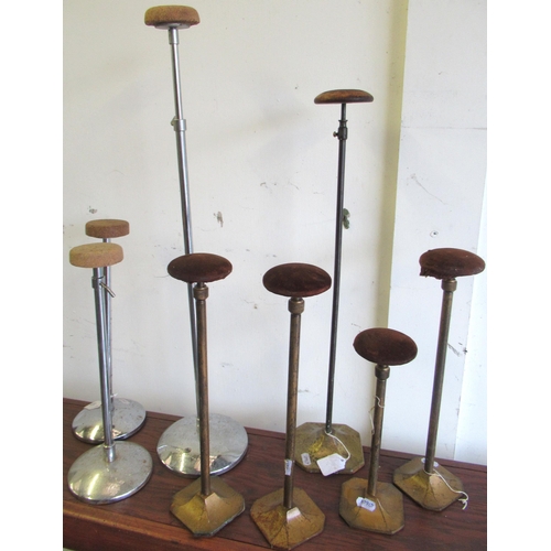 479 - Eight vintage metal hat stands