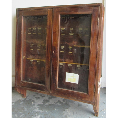 480 - Early 20th century pine hotel/guesthouse key cupboard with glazed cupboard doors and numbered hanger... 