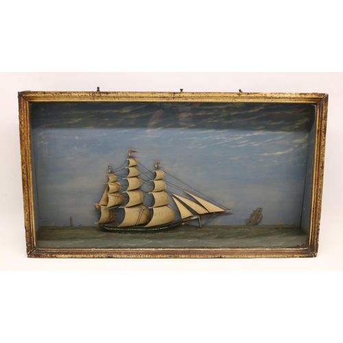 Large 19th century folk art diorama of a clipper ship in full sail, background painted with lighthouse and ships, in period display case, L65cm H36cm