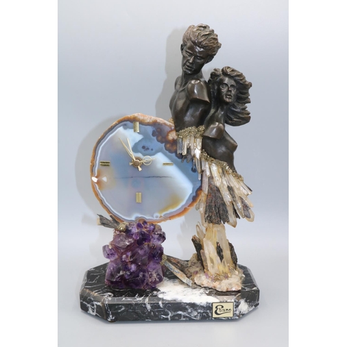 174A - Ebano International, modern agate slice clock mounted with two bronze resin busts, supported by amet... 