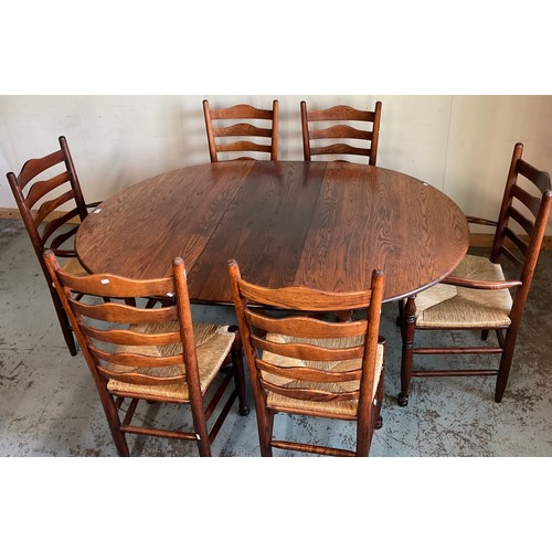 444 - Good quality reproduction oak dining suite comprising; oval extending table on turned supports with ... 