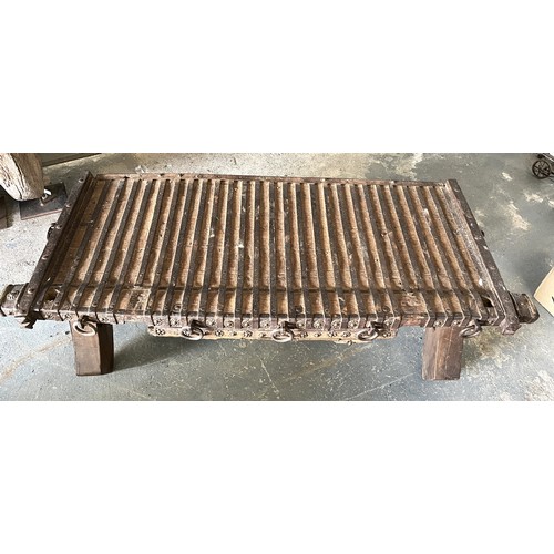 852 - Rajasthan metal banded hardwood day bed, W140cm D59cm H41cm