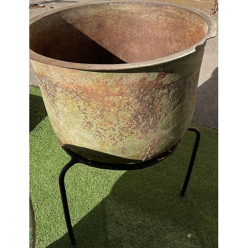 853 - Large Irish cast iron potato pot on circular tripod stand, H87cm