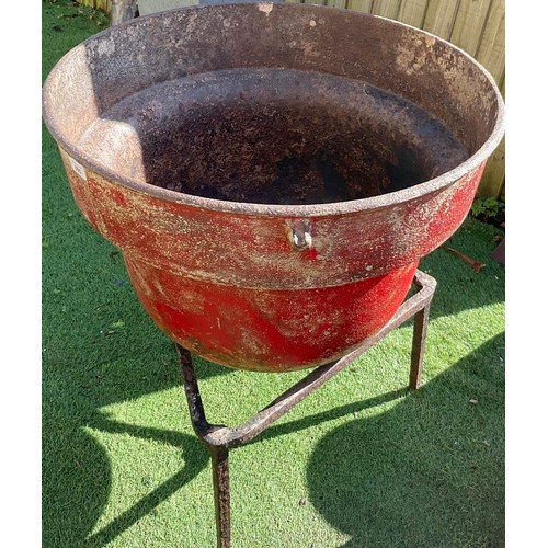 855 - Large Irish red painted cast iron potato pot on triangular tripod stand, H76cm