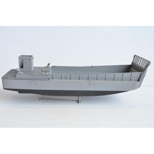 1327 - Original Mobile Marine Stan Tug fibre glass hull (L51cm) and a plastic model landing craft with adde... 