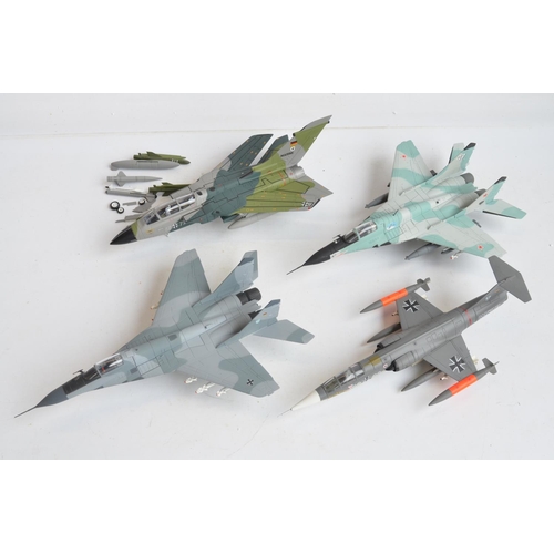 1270 - Four boxed 1/48 scale diecast fast jet models from The Armour Collection to include a German Navy F-... 