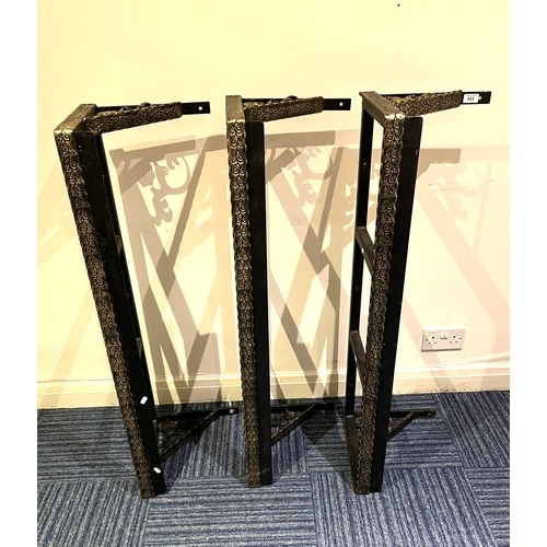 825 - Three wrought metal wall brackets with gilt painted detail, L112cm (3)